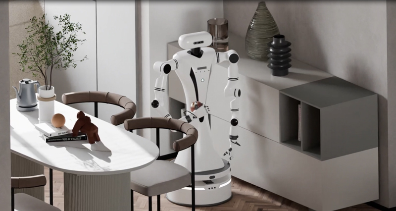 バーチャルシーンでリンゴの掴み取りを練習するロボット。画像提供：取材先
